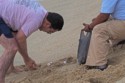 Trying to save turtle eggs that got uncovered by the waves